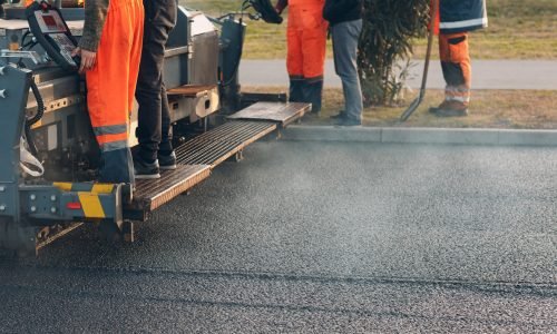 Asphalt paving. Paver machine and workers. New road construction.